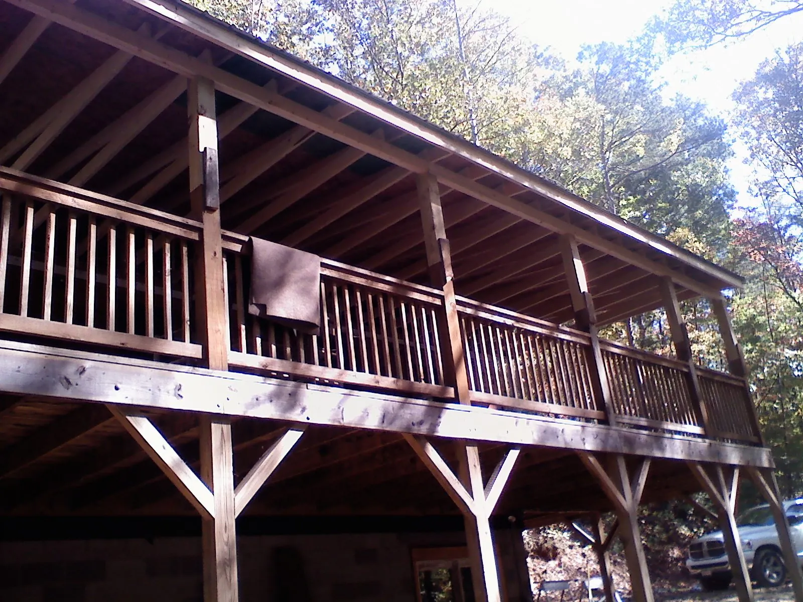 Timber framing under a new elevated porch and deck — Roof Leak Repair in North Lawrence by Roofing Brothers
